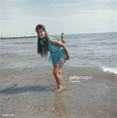 italian actress claudia cardinale posed paddling in the sea on a