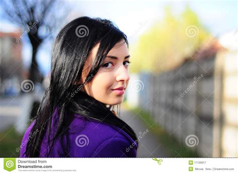 girl smiling looking back stock image image of outdoors