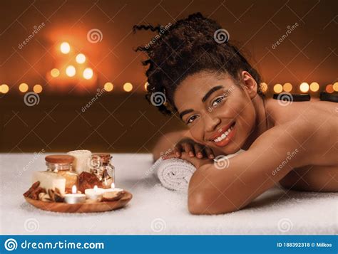 happy black lady enjoying spa day  luxury salon stock photo image