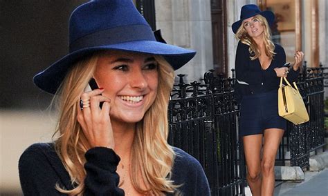 kimberley garner displays her bronzed cleavage and legs in top and