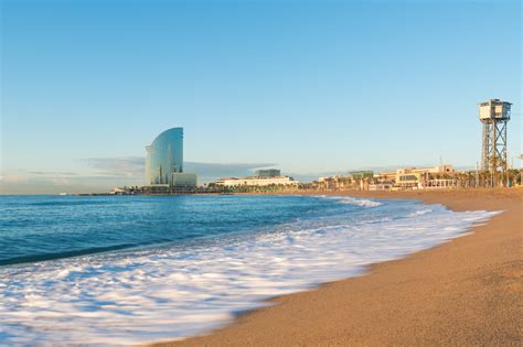 barceloneta beach  barcelona  colorful sky  sunrise sea  story media group