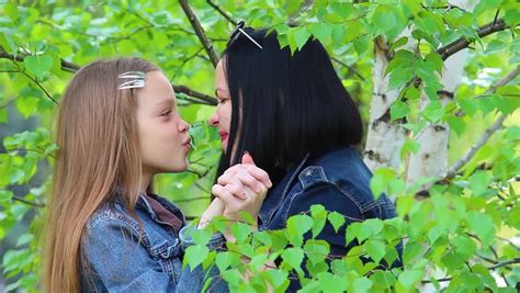 mother and daughter kissing and stock footage video 100
