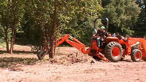 kubota bh  hoe digging  trees youtube