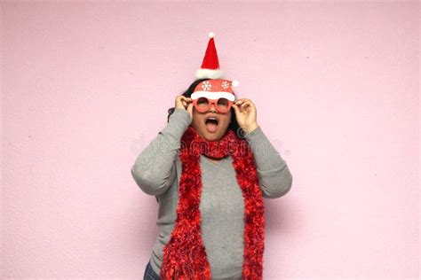 Young Body Positive Fat Latina Woman With Christmas Hat And Glasses