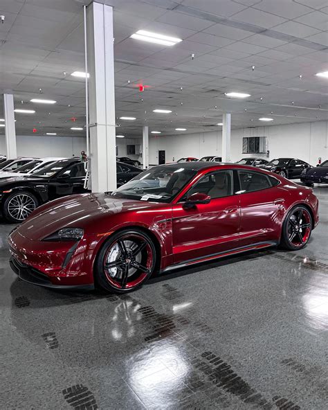 cherry red metallic taycan  color matched wheels   ive     rporsche