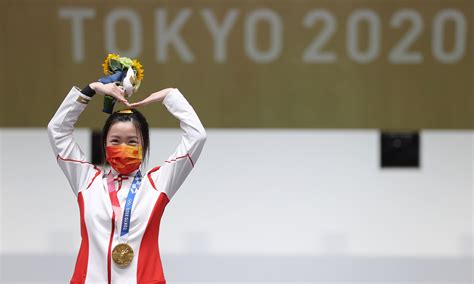 chinese hail   year  athlete  qian wins  tokyo olympics