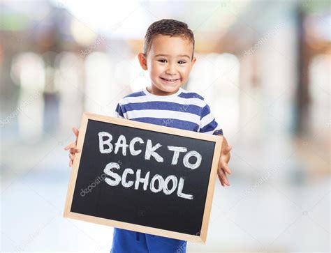 cute kid holding chalkboard stock photo  asierromerocarballo