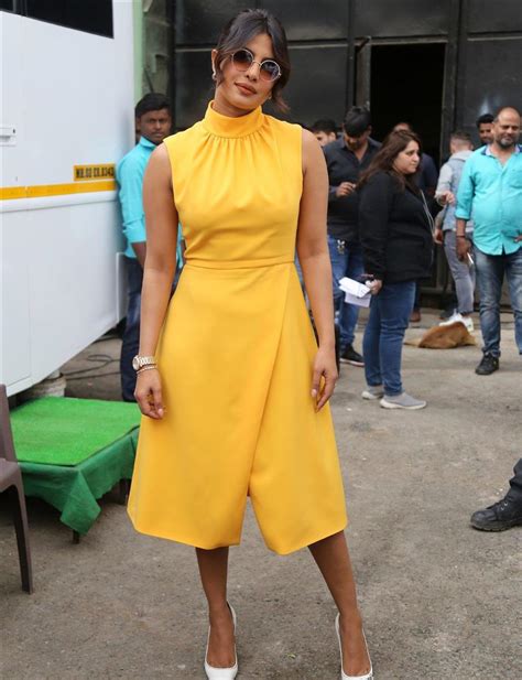 beautiful indian girl priyanka chopra in sleeveless yellow skirt