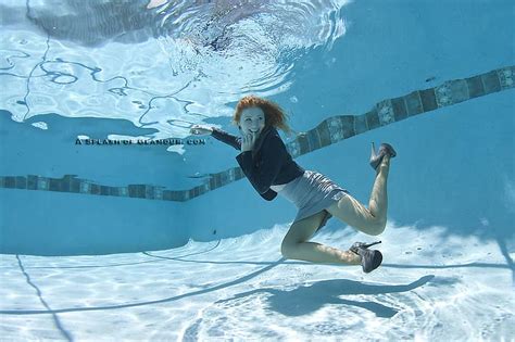swimming pool underwater redhead floating skirt high heels
