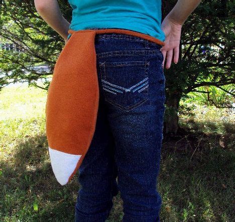 woman  standing   grass      camera holding  orange  white