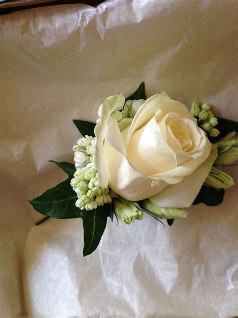 grooms ivory rose and lilac buttonhole wedding flowers