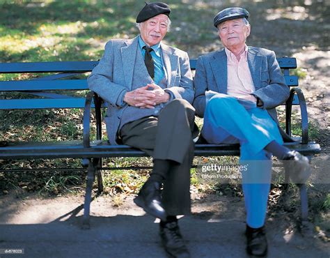Portrait Of Two Old Men Sitting On A Park Bench Photo Getty Images