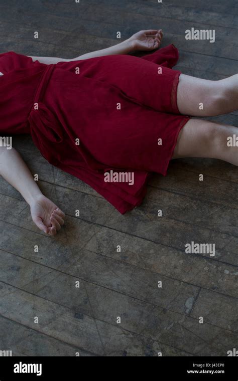 close    dead woman wearing red dress laying    floor stock photo alamy