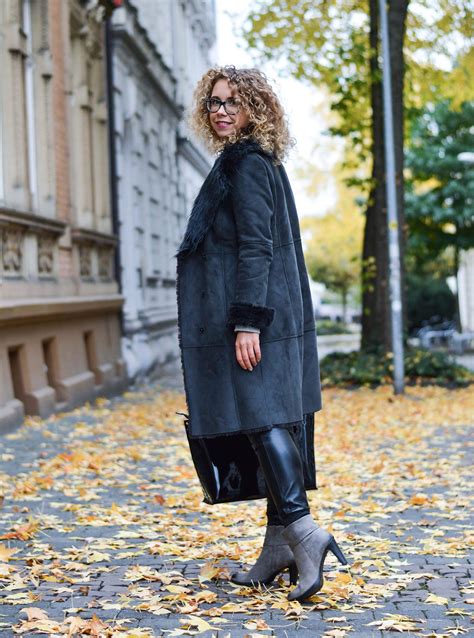 outfit shearling coat leather pants and patent bag mit