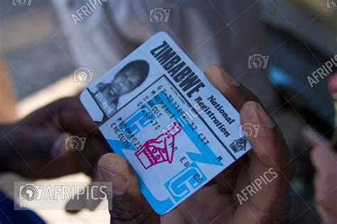 afripics  zimbabwean man holding  zimbabwe national registration