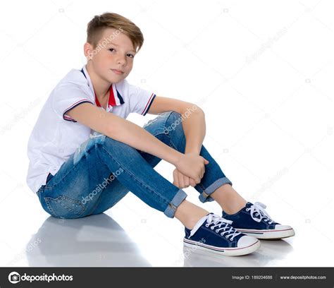 fashionable boy teen sitting   floor stock photo  clotosfoto