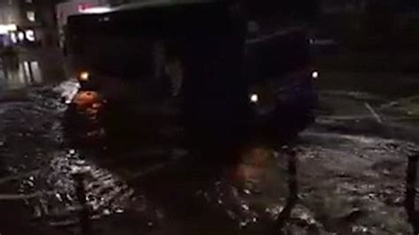 video of coach stuck in flooded sink hole in lewisham metro video