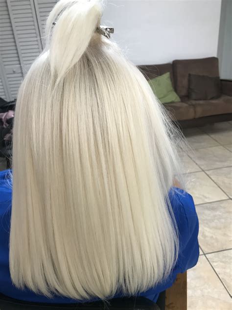 bleach blonde hair bun hairstyles for long hair hair buns hair color