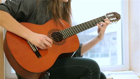 teen girl playing guitar stock footage video 3358688 shutterstock