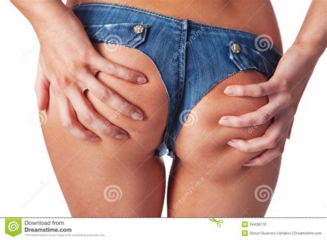close up of woman holding with her hands buttocks stock