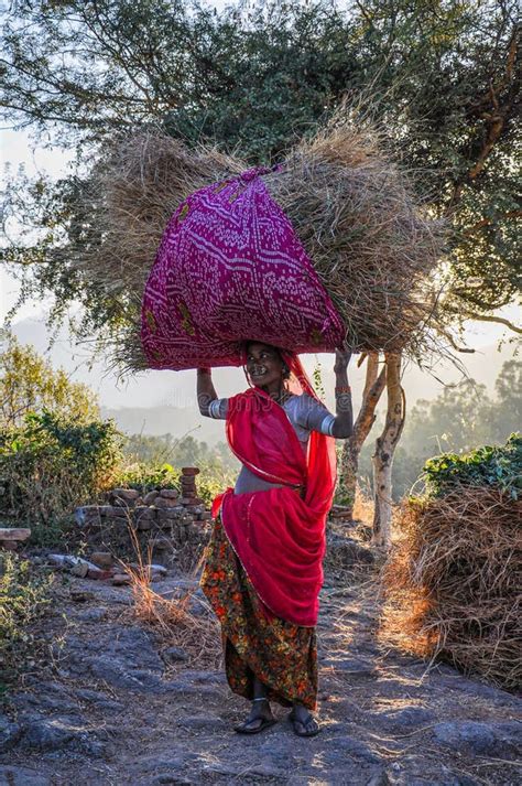 ranakpur india jan 02 2020 indian woman carries hay on her head