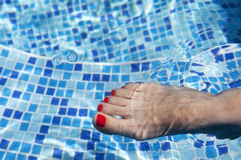 women legs splashing in swimming pool stock image image