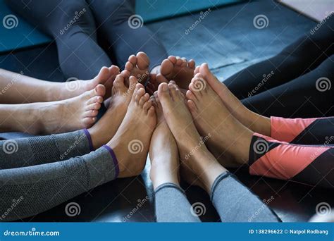 Group Feet Of Fitness People Yoga In Gym Join Foot Together Stock