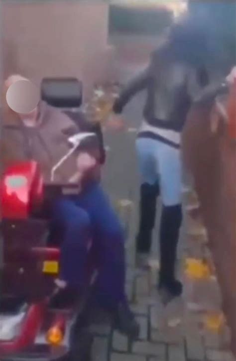 woman performs sex act on man in mobility scooter in broad daylight