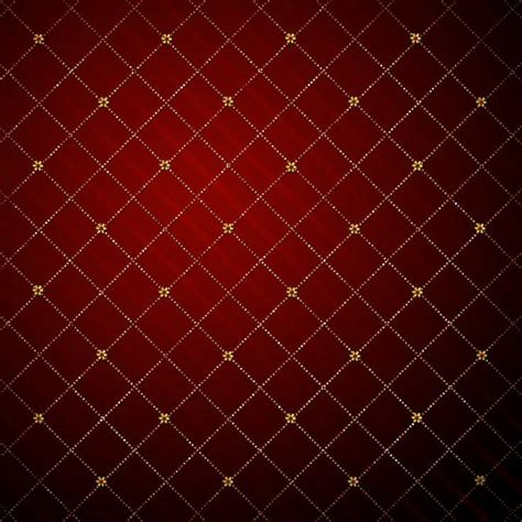 a red and gold background with small squares on it s sides in the