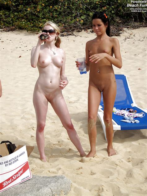 seductive teenage lesbians stripping and caressing each other on the beach