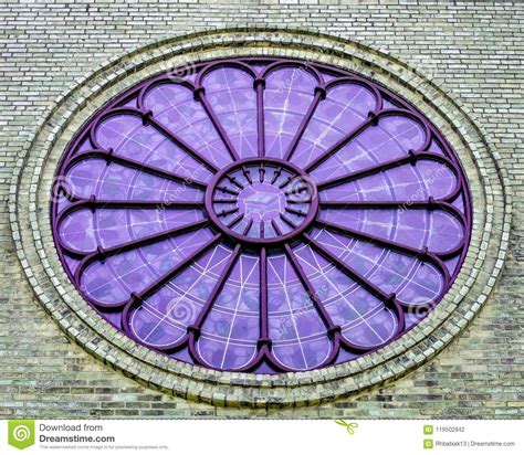 Round Purple Stained Glass Window With Monochrome Bricks