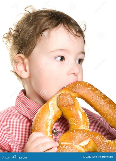 boy  eating  bagel stock images image