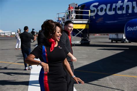 see southwest airlines employees show off their new uniforms at 35 000 feet