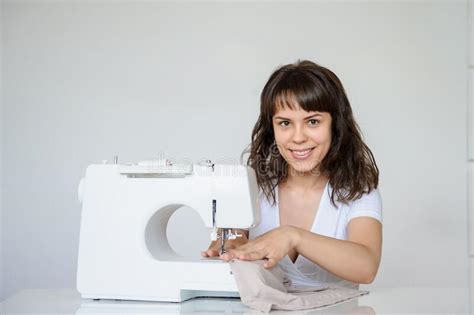 Photo Of A Brunette Working At The Sewing Machine Stock Image Image