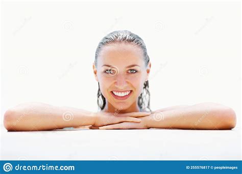 Smiling Female At The Edge Of A Swimming Pool Portrait Of A Cute