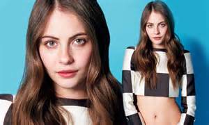 willa holland shows off her superhero figure as she bares