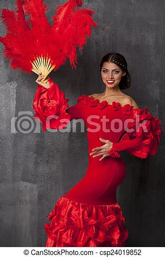 sexy woman traditional spanish flamenco dancer dancing in a red dress