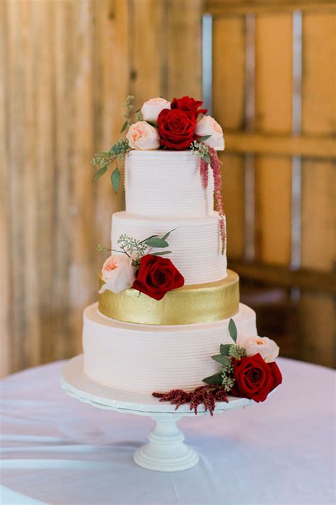 romantic white wedding cake with burgundy flowers wedding decor
