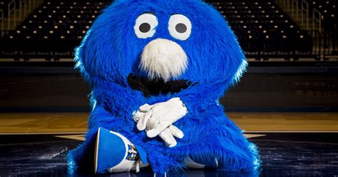 blue blob mascot      cheering  xavier