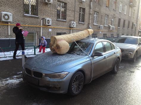 Russian Anti Putin Satirists Have Car Vandalised With Giant Wooden