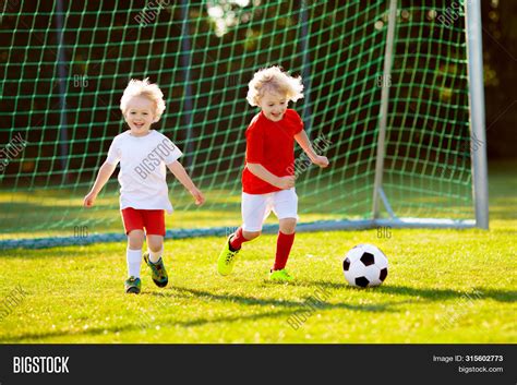 kids play football  image photo  trial bigstock