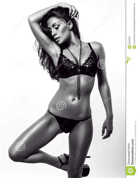 brunette woman with perfect tanned body stock image