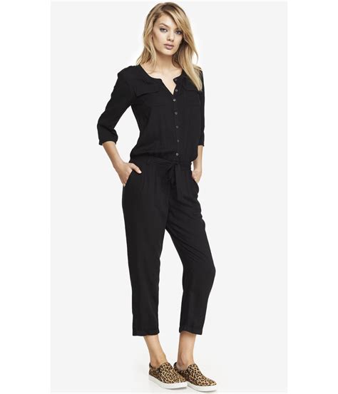 express woven button front jumpsuit in black lyst