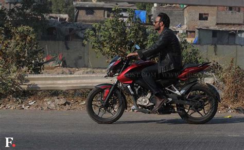 photos check out ajay devgn riding a bike while shooting action jackson firstpost