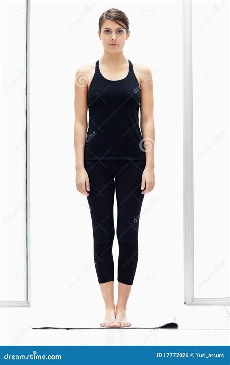 young female standing straight   yoga mat stock photo image