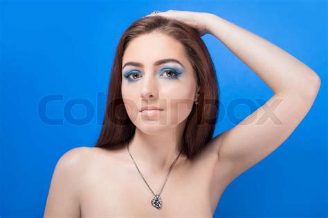Beautiful Naked Girl With Bright Blue Makeup And Jewelery Stock Image