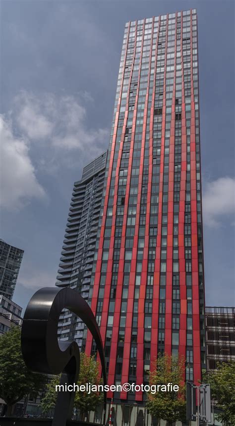 red apple rotterdam long exposure photography red apple skyscraper multi story building