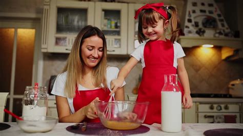 mom teaches daughter to cook stock video footage 4k and
