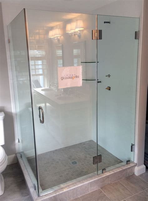 A Frameless Swinging Shower Door Hinged From The