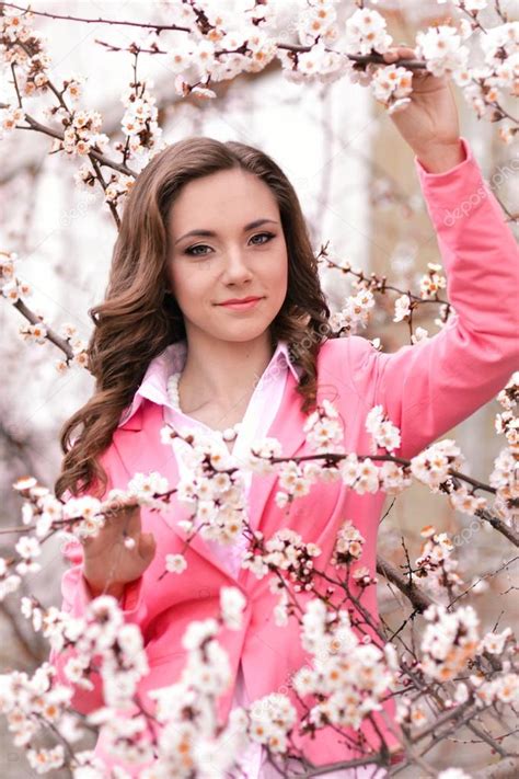 Very Beautiful Girl In Blossoming Trees In Spring Garden
